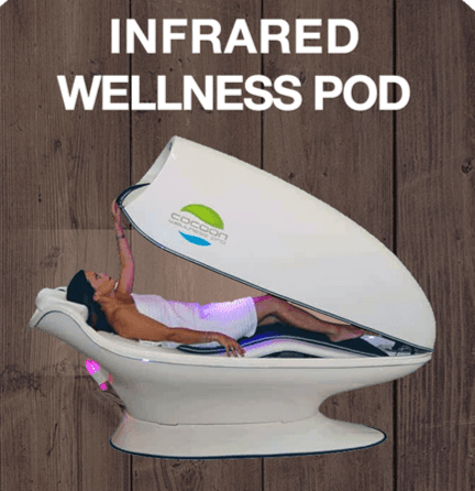 A person relaxing in the Cocoon infrared wellness pod